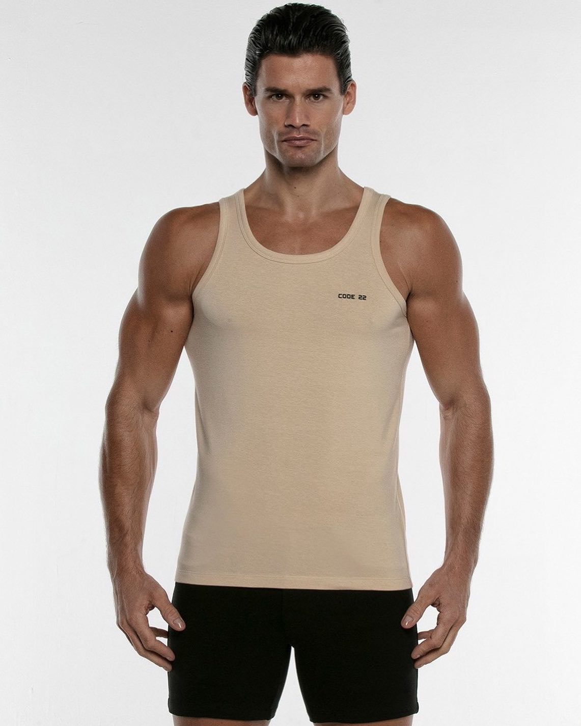 The Basics Tanktop of CODE 22 is a versatile and stylish essential top, made with the finest fabric, feeling very comfortable against the skin. Available in beige (photo), grey, black or white: 
____
https://menandunderwear.com/shop/tops/code-22-basics-tanktop-beige